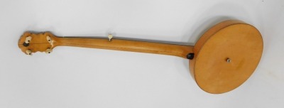 An Apollo banjo, with a beech reeded case, with mother of pearl points, and bone tuning pegs, in fitted case, 90cm long, - 2