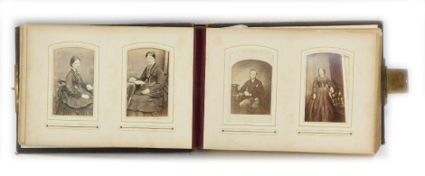 A late Victorian/Edwardian embossed leather photograph album, including an extensive selection of portrait photographs of the period.