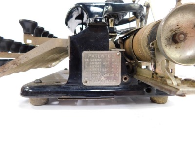 A late Victorian Patent portable typewriter, serial no 76328, in an elm case, ZXKG keyboard, and having a handwritten postcard, stating 'First used for the Production of the Isle of Wight Chronicle'. - 3