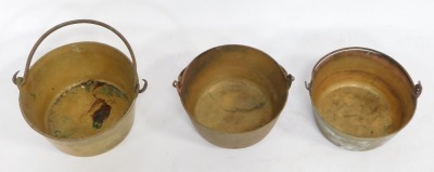 Three graduated Victorian swing handle preserve pans, largest 28cm diameter. (3) - 2