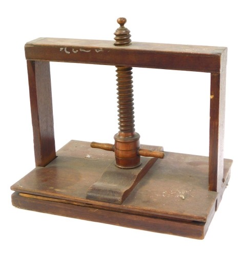 An early 19thC oak table top book press, 43cm wide.