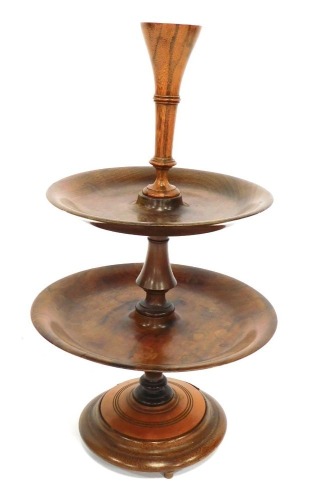 A walnut and palm centrepiece, with a vase to the top above two dished tiers, 57cm high.