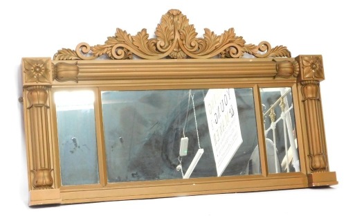 A 19thC gilt framed overmantel mirror, with foliate top, and three paneled mirror section, 75cm high, 112cm wide, 6cm deep.