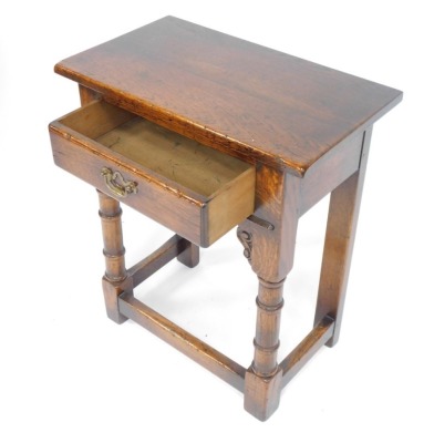 An oak side table, with turned legs on stretchered frame base, 71cm high, 62cm wide, 35cm deep. - 2