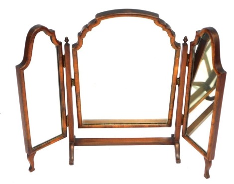 A walnut framed dressing table mirror, with the central shield swing mirror with two mirrored panels on splayed legs, 63cm high, 68cm wide.