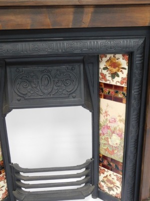 A Victorian style fireplace, with stained pine surround and majolica type tiles to the cast iron inset, 123cm high, 106cm wide, 20cm deep. - 2