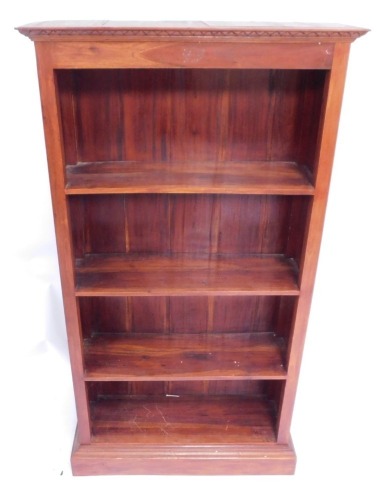 A walnut bookcase, with moulded cornice and three shelves on plinth base, 180cm high, 90cm wide, 29cm deep.