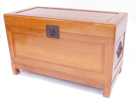 An oriental camphorwood chest, of plain design, with side handles and supports, with shelf interior, 61cm high, 98cm wide, 55cm deep.