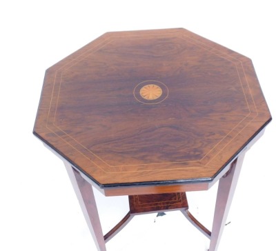An Edwardian rosewood octagonal occasional table, with strung outer border and shelf centre, on square set base on tapered legs terminating in castors, 69cm high, the top 61cm x 61cm. - 2