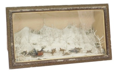 A 19thC Diorama of Russian scene, in glass display case, with figures on sledge, shooting wolves eating a dead horse, in mahogany case with snowy scene interior, 52cm high, 93cm wide, 40cm deep.