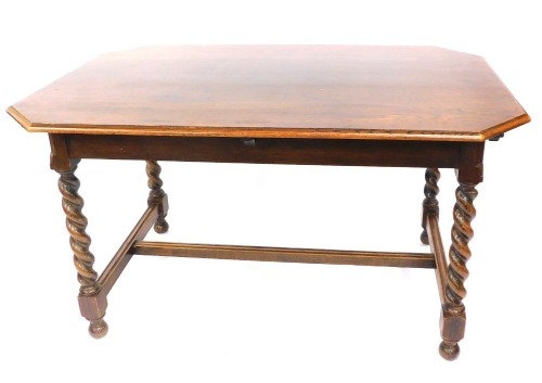 An oak dining table, the rectangular top with canted corners on a H frame base with twist column supports on bun feet, 76cm high, 134cm wide, 88cm deep.