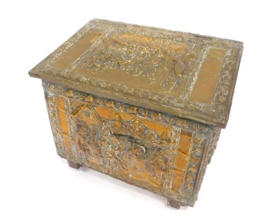 A copper log box, with embossed figures by buildings, and contents of logs, 51cm high, 56cm wide, 34cm deep.