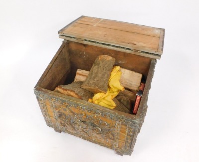 A copper log box, with embossed figures by buildings, and contents of logs, 51cm high, 56cm wide, 34cm deep. - 2