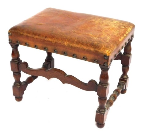 A late 19thC oak and tan leather footstool, 44cm high, 55cm wide, 40cm deep. (AF)