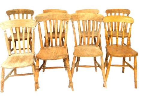 Seven 19thC and later beech and elm lath back kitchen chairs.