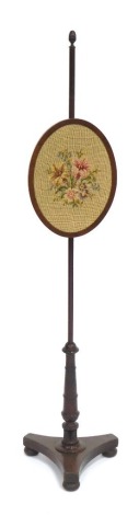 A Victorian pole screen, with oval banner with floral tapestry inlay, on tripod base, 150cm high, 36cm wide.