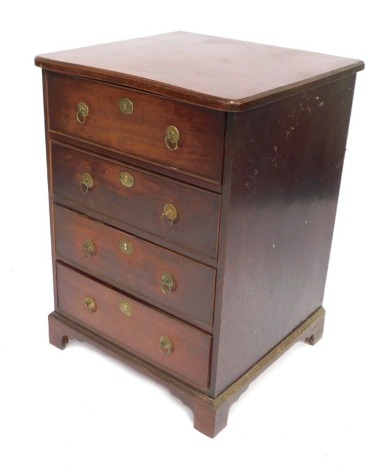 A George III mahogany four drawer chest, with a shaped front, on bracket feet, 78cm high, 56cm wide, 52cm deep.