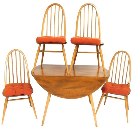 An Ercol light elm table and chairs, the drop leaf kitchen table on tapered supports with four stick back chairs, the table 72cm high, 100cm wide, 61cm deep.