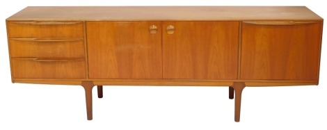 An A H Mackintosh & Company teak sideboard, with arrangement of three drawers, two central cupboard doors, and single cupboard door, on tapered legs, 74cm high, 210cm wide, 45cm deep.