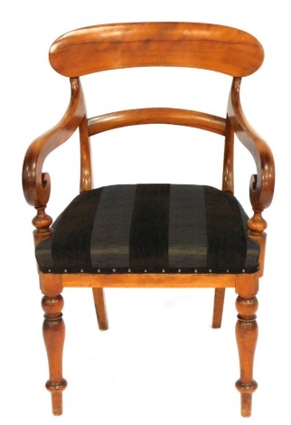 A 19thC oak carver chair, with carved back and splayed arms, on a brown upholstered seat.