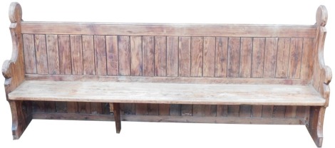 A Victorian pine church pew, No 4, 111cm high, 250cm wide, 40cm deep.