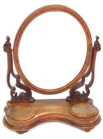 A Victorian mahogany swing frame dressing table mirror, with cabriole scroll supports and two compartments, 64cm high, 56cm wide, 24cm deep.