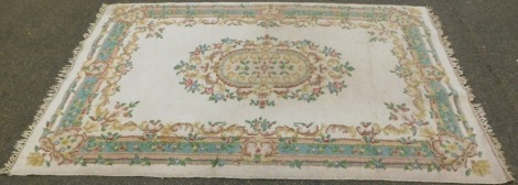 An Indian carpet, on a cream ground with central floral design, 280cm x 179cm.