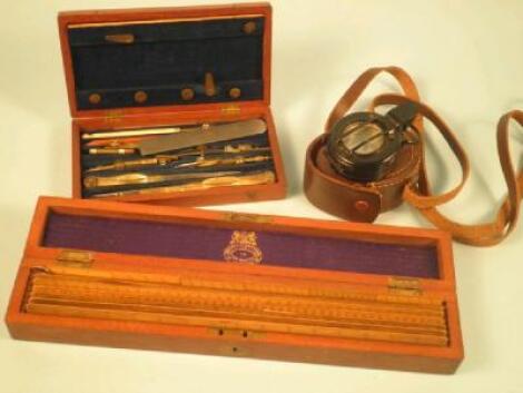 A set of seven boxwood rulers in a fitted mahogany case made by Negretti