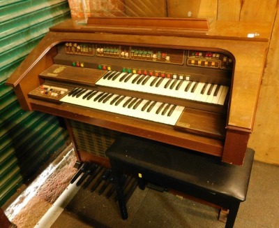 A Solina K150 electric organ, with stool.