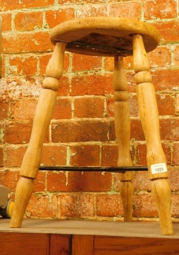 A pine workshop stool.