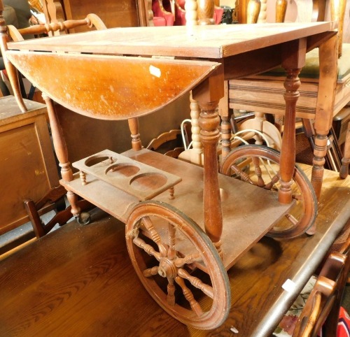 A teak drinks trolley.