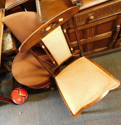 Two dining chairs, comprising an Edwardian dining chair with mother of pearl inlay and a 1920's/1930's tub chair. (2) The upholstery in this lot does not comply with the 1988 (Fire & Fire Furnishing) Regulations, unless sold to a known exporter or upholst