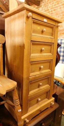 A pine five drawer chest, with galleried back.