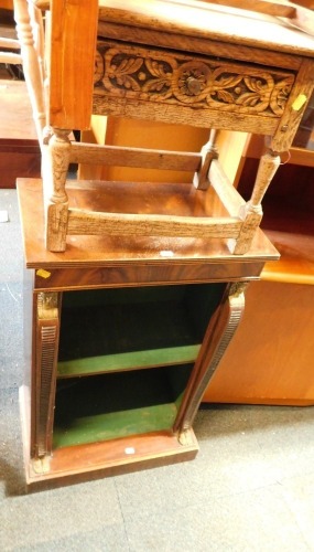 A small mahogany open bookcase, decorated in early 19thC style with Egyptian masks and an oak work table.