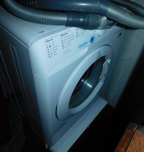An Indesit washer/dryer.