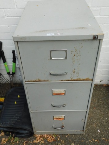 A three drawer filing cabinet.