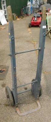 A wooden and metal framed sack barrow.