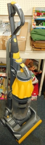 A Dyson upright vacuum cleaner.WARNING! This lot contains untested or unsafe electrical items.  It is supplied for scrap or re-conditioning only.  TRADE ONLY