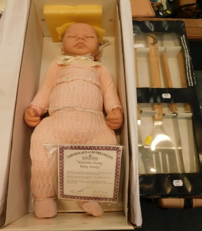 An Ashton Drake Galleries porcelain doll, and a Pro Cook three piece wooden handle BBQ tool set. (2)