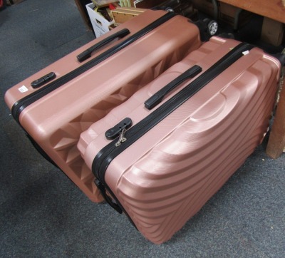 Two graduated sets of three travel cases, 70cm high, 47cm wide, 31cm deep and 66cm high, 45cm wide, and 29cm deep.  