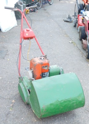 A Suffolk Punch petrol mower.