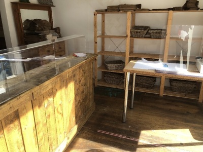 SOLD. The residual contents of the shop and store room, being two wooden counters, four shelved racks, stock of bags, cake stands & covers, etc. NB. VAT is payable on this lot at 20%. To be sold upon instructions from Vine's Bakery Ltd (in proposed liquid - 2