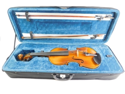 A 20thC violin, with two bows, one stamped P&H London in outer case, two piece back, the case 77cm wide. - 3