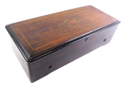 A late 19thC rosewood cylinder music box, playing on eight airs, with brass cylinder and graduated comb, in an ebonised and florally inlaid case, 54cm wide.