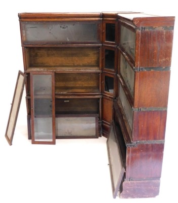 An early 20thC Globe Wernicke oak bookcase, in three parts, comprising two four section bookcases and a corner bookcase, 142cm high, 223cm wide approx. (AF)