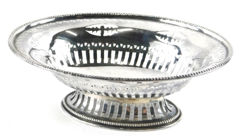 An Edwardian silver basket, by Steinhart & Co, of oval form, partially pierced on oval foot, Birmingham 1908, 18cm wide, 4.2oz.