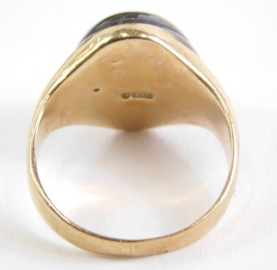 A 9ct gold dress ring, inset with red stone, size G, 5.3g all in. - 3