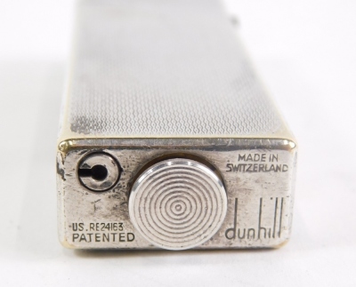 A mid-20thC Dunhill pocket lighter, with engine turned rectangular body, 6cm high. - 2