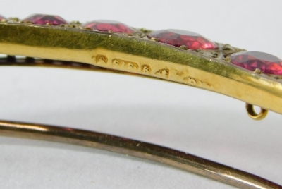 A 9ct gold crescent brooch, in the Edwardian style set with fifteen red paste stones. - 2