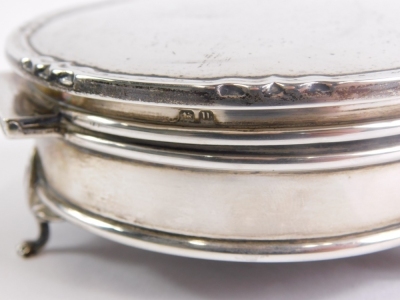 Various silver, an Edwardian ring stand, repousse decorated with scrolls and flowers, Birmingham, 1907, 10cm wide, a jewellery box, hand mirror, sugar tongs, spoons and an unmarked miniature boat, white metal, 16oz all in. (a quantity) - 2